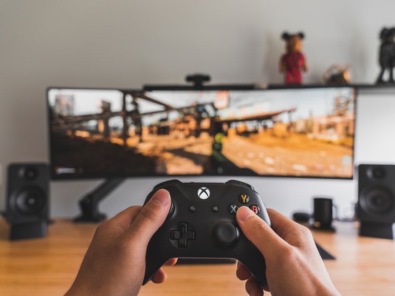 A candlelit desk with controller and inkwell